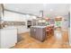 Modern kitchen with stainless steel appliances and an island with bar seating at 127 Fantasy Ln, Mooresville, NC 28117