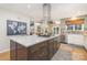 Modern kitchen featuring a large island, stainless steel range hood, and updated countertops at 127 Fantasy Ln, Mooresville, NC 28117