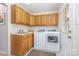 Functional laundry room with white appliances, ample cabinet storage, and sink at 127 Fantasy Ln, Mooresville, NC 28117