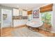 Cozy living room with a wet bar, large windows, and comfortable seating at 127 Fantasy Ln, Mooresville, NC 28117