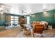 Stylish living room featuring a ping pong table, cozy seating, and shelving at 127 Fantasy Ln, Mooresville, NC 28117