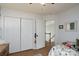 Bright bedroom with a ceiling fan, plush toys, and a large closet at 13228 Crooked Pine Ct, Charlotte, NC 28215