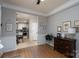 Inviting dining room featuring wood floors, detailed trim, and an open view to the kitchen at 13228 Crooked Pine Ct, Charlotte, NC 28215