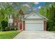 Charming two-story home with a brick and siding exterior, and an attached two-car garage at 13228 Crooked Pine Ct, Charlotte, NC 28215