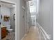 Welcoming hallway with a high ceiling, tiled floors, and a view of the staircase and entry at 13228 Crooked Pine Ct, Charlotte, NC 28215