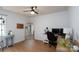 Spacious home office with a desk, computer setup, and ample natural light at 13228 Crooked Pine Ct, Charlotte, NC 28215