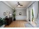Inviting living room with hardwood floors, a large window, and access to the outdoor deck at 13228 Crooked Pine Ct, Charlotte, NC 28215