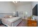 Spacious main bedroom with neutral décor, vaulted ceiling and access to ensuite bathroom at 13228 Crooked Pine Ct, Charlotte, NC 28215