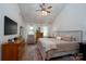 Spacious main bedroom with a vaulted ceiling, ceiling fan, and neutral décor at 13228 Crooked Pine Ct, Charlotte, NC 28215