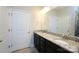 Modern bathroom with dual sinks, granite countertops, and a large mirror at 1333 Rainier Dr, Fort Mill, SC 29708