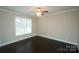 This bedroom features hardwood floors, neutral walls and a ceiling fan for a light and airy feel at 1333 Rainier Dr, Fort Mill, SC 29708