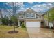 Charming two-story townhome with a well-manicured lawn and attached two-car garage at 1333 Rainier Dr, Fort Mill, SC 29708