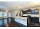 Modern kitchen with granite island, stainless steel appliances, and open floor plan at 1333 Rainier Dr, Fort Mill, SC 29708