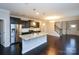 Stylish kitchen with granite island, stainless steel appliances, and dark hardwood floors at 1333 Rainier Dr, Fort Mill, SC 29708