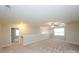 Loft area boasts neutral walls, carpet flooring, a ceiling fan, and lots of natural light at 1333 Rainier Dr, Fort Mill, SC 29708