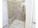Modern bathroom shower with glass enclosure and ceramic tile and built in seat for a luxurious bathing experience at 1333 Rainier Dr, Fort Mill, SC 29708