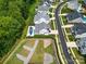 Aerial shot showcasing a neighborhood with well-maintained homes, manicured lawns, and winding streets at 14013 Pinoli Pine Cir, Huntersville, NC 28078