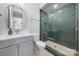 Bathroom featuring vanity and tiled glass shower and designer mirror and lighting at 14013 Pinoli Pine Cir, Huntersville, NC 28078