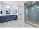Elegant bathroom featuring tiled shower, patterned floor, and dual sink vanity at 14013 Pinoli Pine Cir, Huntersville, NC 28078