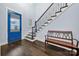 Foyer with hardwood flooring, blue door with decorative glass, staircase with dark wood banister and white risers at 14013 Pinoli Pine Cir, Huntersville, NC 28078