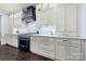 This beautifully designed kitchen features custom cabinets, modern appliances, and stylish backsplash at 14013 Pinoli Pine Cir, Huntersville, NC 28078
