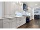 Well-appointed kitchen with custom cabinetry, stainless appliances, and stylish fixtures at 14013 Pinoli Pine Cir, Huntersville, NC 28078