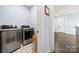 Convenient laundry room with side-by-side washer and dryer at 14013 Pinoli Pine Cir, Huntersville, NC 28078