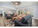 Spacious open-concept living room flowing into the kitchen and dining areas, perfect for entertaining at 14013 Pinoli Pine Cir, Huntersville, NC 28078