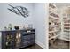 Convenient butler's pantry with storage cabinets and a walk-in pantry at 14013 Pinoli Pine Cir, Huntersville, NC 28078