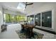 Covered patio boasts a skylight, ceiling fan, and sliding glass doors leading to a pool and the interior at 14013 Pinoli Pine Cir, Huntersville, NC 28078