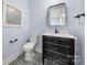 Stylish powder room with designer tile floor and modern fixtures at 14013 Pinoli Pine Cir, Huntersville, NC 28078