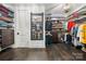 Spacious walk-in closet with custom shelving and modern mirror at 14013 Pinoli Pine Cir, Huntersville, NC 28078