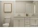 Bright bathroom boasts a double vanity, framed mirror, and elegant decorative accents at 1512 Croydon St, Indian Land, SC 29707