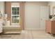 Bright Bedroom featuring a crib, dresser, and a window with pink curtains at 1512 Croydon St, Indian Land, SC 29707