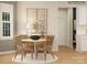 The dining area features a round table, four chairs, and modern art pieces on the wall at 1512 Croydon St, Indian Land, SC 29707