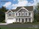 Charming two-story home showcasing a welcoming front porch and a well-manicured lawn at 1512 Croydon St, Indian Land, SC 29707