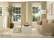 Cozy living room with large windows, a comfortable sofa, and contemporary accents at 1512 Croydon St, Indian Land, SC 29707