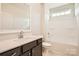 Bright bathroom features a modern vanity with granite counters, and a tiled shower over tub at 1541 Croydon St, Indian Land, SC 29707