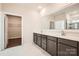 Well-lit bathroom features double sinks, modern cabinets, granite counters, and a walk-in shower at 1541 Croydon St, Indian Land, SC 29707