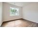 Bedroom with wood floor, natural light, and neutral wall color at 1541 Croydon St, Indian Land, SC 29707