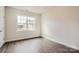 Bedroom with wood floor, neutral wall color, and natural light at 1541 Croydon St, Indian Land, SC 29707