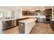 Modern kitchen boasts a large island, stainless steel appliances, ample cabinet space, and sleek countertops at 1541 Croydon St, Indian Land, SC 29707