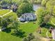Aerial view of a luxurious home, lush green lawns and landscaping at 1700 White Pond Ln, Waxhaw, NC 28173