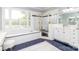 Bright bathroom featuring a luxurious soaking tub and separate glass enclosed shower at 1700 White Pond Ln, Waxhaw, NC 28173