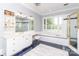 Elegant bathroom with soaking tub, glass-enclosed shower, and white vanity at 1700 White Pond Ln, Waxhaw, NC 28173