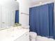 Clean bathroom featuring a blue shower curtain at 1700 White Pond Ln, Waxhaw, NC 28173