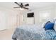 Bright bedroom with TV and plenty of natural light streaming through multiple windows at 1700 White Pond Ln, Waxhaw, NC 28173