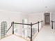 Open hallway with hardwood flooring and views to the downstairs foyer with lots of light at 1700 White Pond Ln, Waxhaw, NC 28173