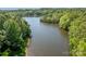 Scenic aerial view of the lake surrounded by lush greenery at 1700 White Pond Ln, Waxhaw, NC 28173