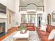 Elegant living room with hardwood floors, soaring ceilings, and comfortable leather furniture at 1700 White Pond Ln, Waxhaw, NC 28173